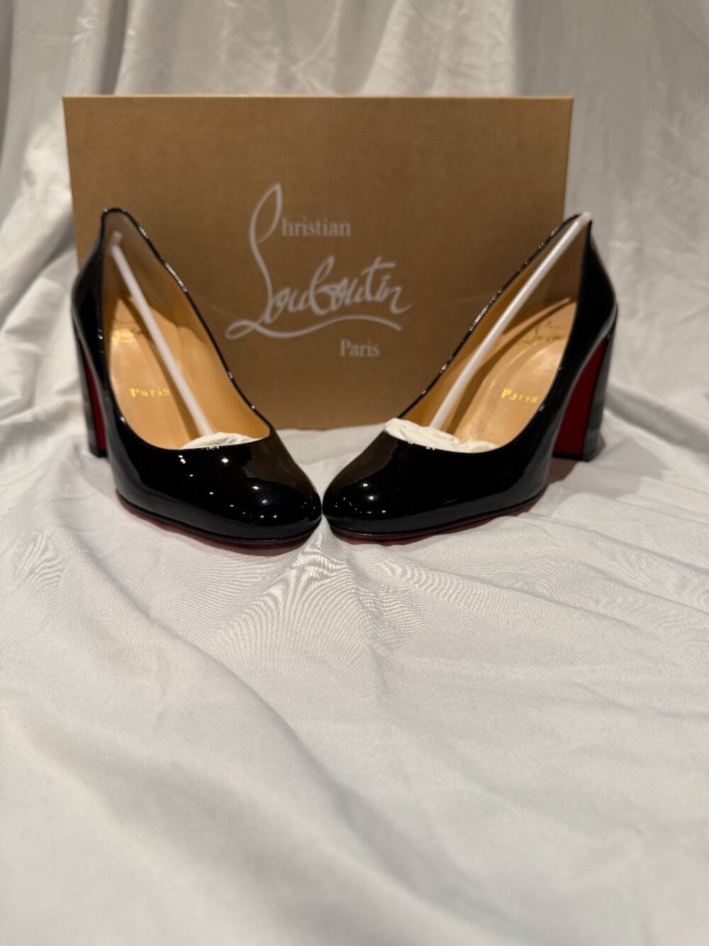 Authentic Christian Louboutin black patent leather pumps.